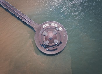 Aerial Photography of Round Brown Structure on Ocean