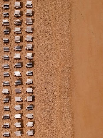 aerial photography of sunloungers