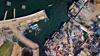 Aerial Photography of Town Near Body of Water