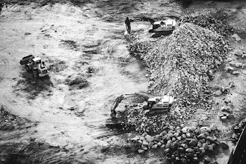 Aerial Photography of Two Excavators on Pile of Stones