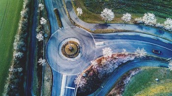 aerial photography of vehicle cross road