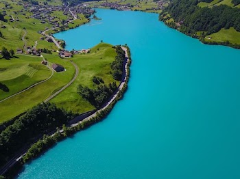 aerial photography of village near body of water
