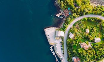 Aerial Photography of Village Near Body of Water