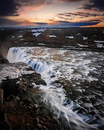 aerial photography of waterfalls during golden hour