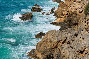 Aerial Photography Of Waves Crashing On Rocks