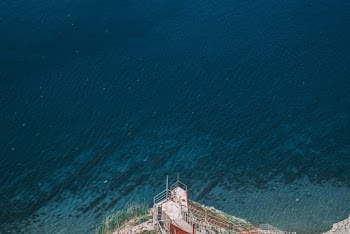 Aerial Photography of White Lighthouse on Seacliff