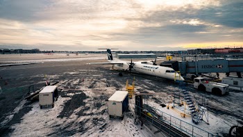 Aerial Photography of White Passenger Airplane Under White and Gray Sky