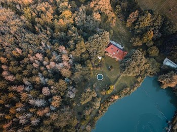 aerial photography on brown mansion near body of water
