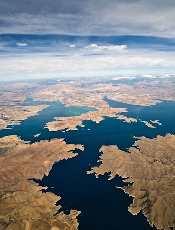 aerial shot of body of water surrounded by land