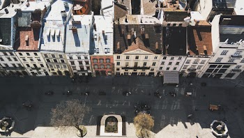 Aerial Shot Of Vehicles on Road Beside Buildings
