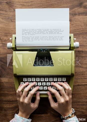 Aerial view a woman using a retro typewriter