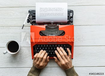 Aerial view of a man typing on a retro typewriter