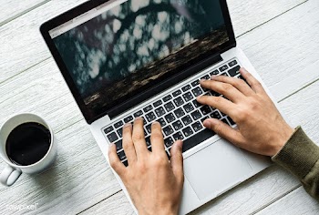 Aerial view of a man using computer laptop on.. | Free stock psd mockup - 385163