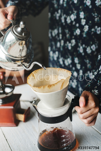 Aerial view of a person making drip coffee