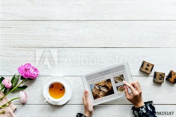 Aerial view of a woman using digital tablet cooking hobby concept