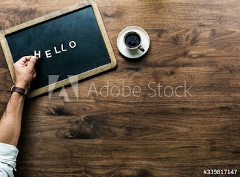 Aerial view of black board with the letter forming hello greeting concept
