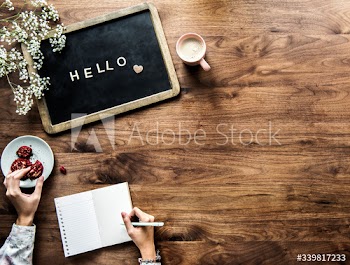 Aerial view of black board with the letter forming hello greeting concept
