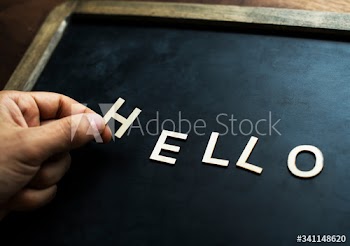 Aerial view of black board with the letter forming hello greeting concept