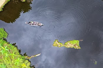 Aerial View Of Boat In The Middle Of Body Of Water