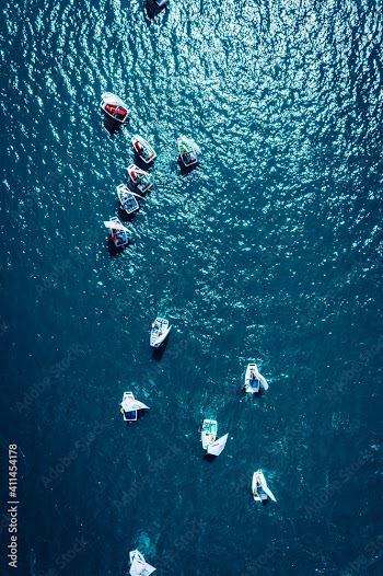 Aerial view of boats regatta on blue lake