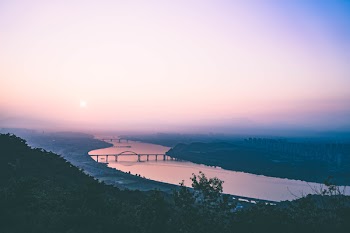 Aerial View of Body of Water during Sunset