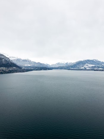 aerial view of body of water near mountain