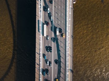 aerial view of bridge with cars