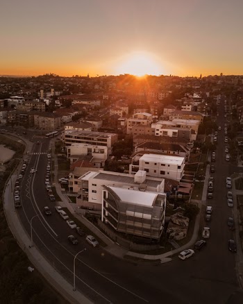 Aerial View Of Buildings With Sunset Background
