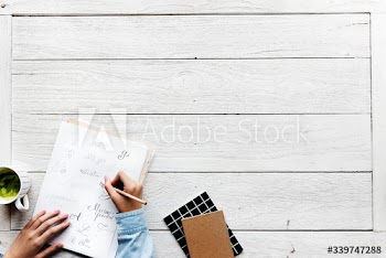Aerial view of caligraphy artist working workspace concept with copy space