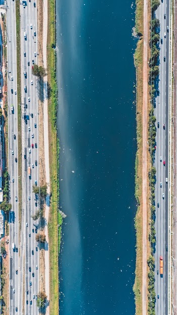 Aerial View of Canal Between Roads