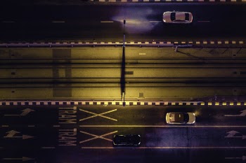 Aerial View of Cars on Gray Highway