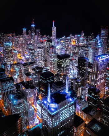 Aerial View Of City Buildings At Night