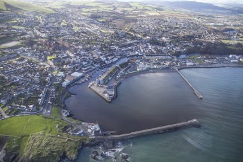 Aerial View Of City Near Body Of Water