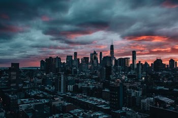 aerial view of city of buildings under gray sky