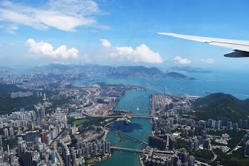 Aerial View of City Through Airplane Window