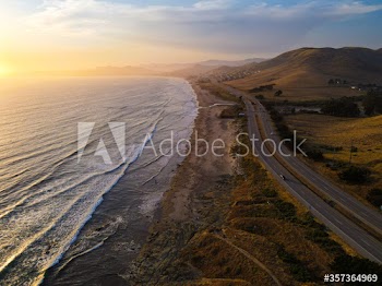 Aerial view of coastal road during sunset