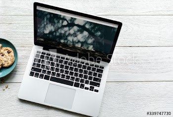 Aerial view of computer laptop on wooden table