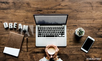 Aerial view of computer laptop on wooden table