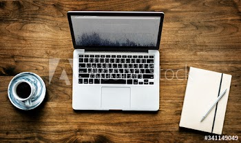 Aerial view of computer laptop on wooden table workspace concept