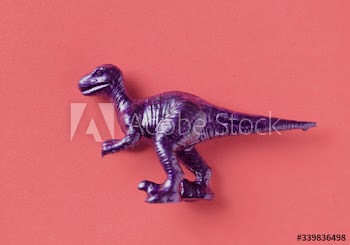 Aerial view of dinosaur toy with colorful background