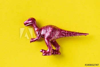 Aerial view of dinosaur toy with colorful background