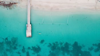 aerial view of dock surrounded by body of water