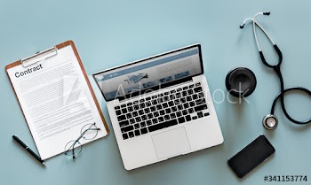 Aerial view of doctor stethoscope and computer laptop