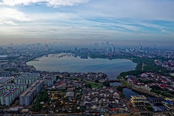 Aerial View of Lake Surrounded With Buildings and Houses