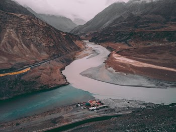 Aerial View of Lake Surrounded With Mountains