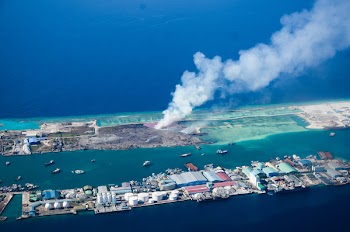 Aerial View of Land Blowing Smoke