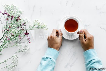 Aerial view of man with a hot cup of tea