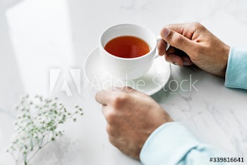 Aerial view of man with a hot cup of tea