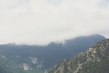 aerial view of mountain covered in clouds