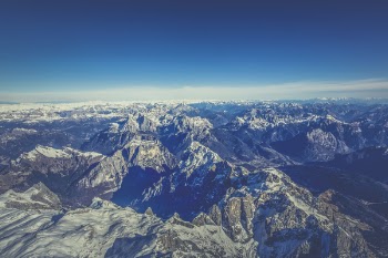 Aerial View of Mountain Under Blue Sky during Day Time